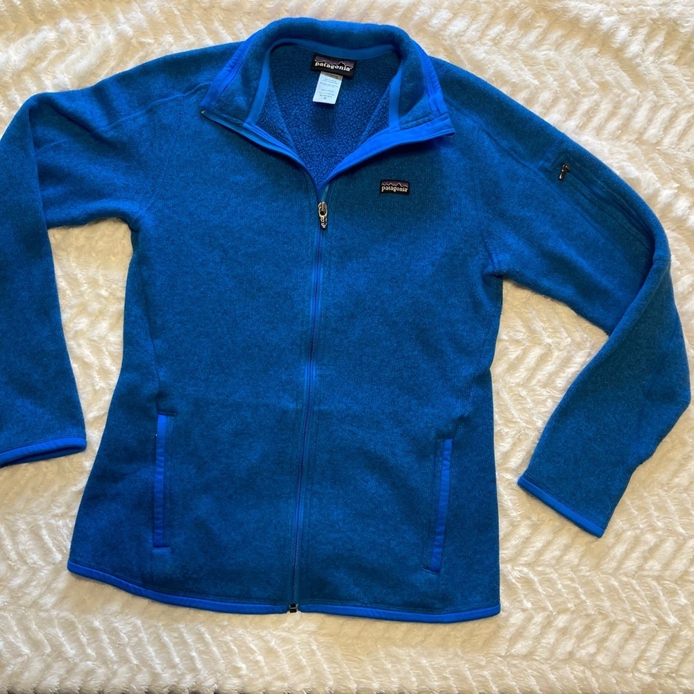 Patagonia medium blue zip up sweater.